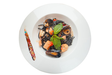 delicious black spaghetti Neri with cream sauce and seafood