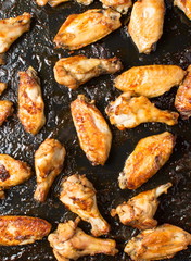 bbq chicken wings on a black plate