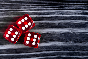 risk concept playing dice at dark wooden background top view