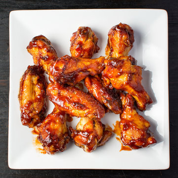Baked chicken wings on a white plate