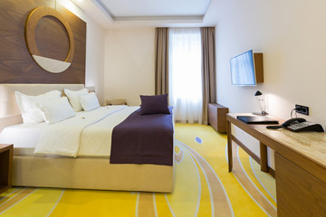 Bedroom in modern hotel room interior