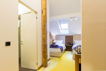 Interior of a hotel bedroom in the attic