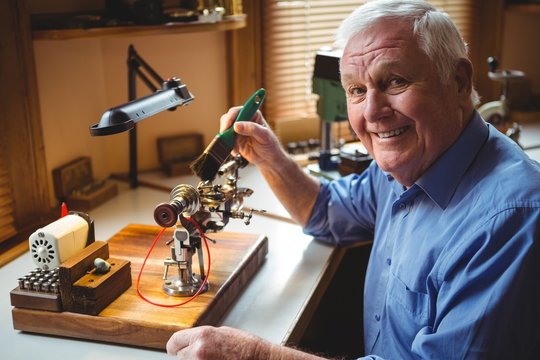 Horologist repairing a watch in the workshop