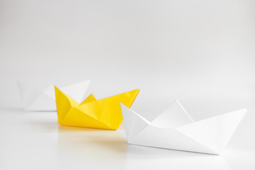 choice concept paper boats on white background
