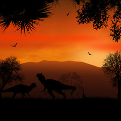 Naklejka na ściany i meble Dinosaurs silhouettes in beautiful landscape