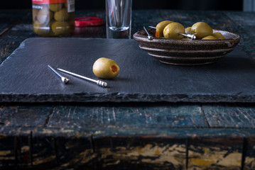 Pimiento stuffed queen olives in table setting