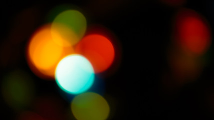 Multicolored soft bokeh on a black background