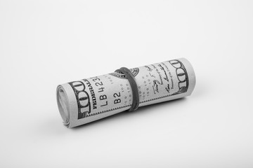 Close up shot of dollar roll tightened with band isolated on white background. Shoot in black and white shot.