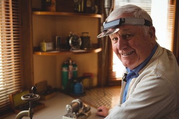 Portrait of smiling horologist