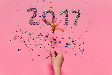 2017 made of multicolored confetti bright glowing new years eve font lettering number date