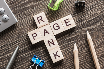 Conceptual media keywords on table with elements of game making crossword