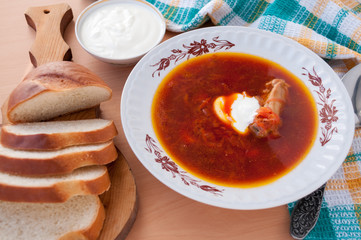 For lunch, borscht with sour cream and white bread 