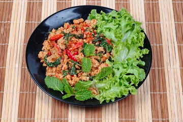 Fried spicy basil with minced pork topped lettuce.
