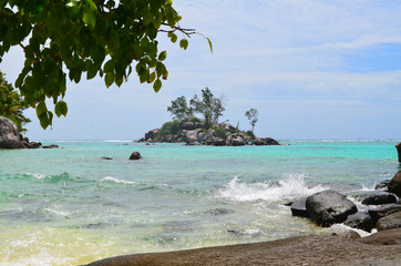 Little island in blue waters