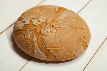 Bread on a white wooden background