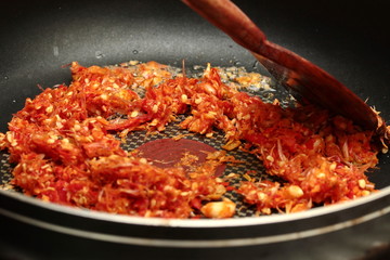 Cooking of fried spicy basil with minced pork topped lettuce.