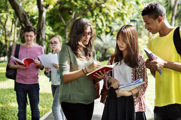 Diverse Young Students Book Outdoors Concept