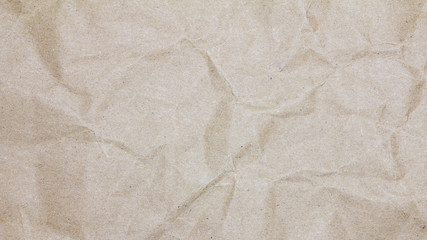Recycled crumpled brown paper texture or paper background for design with copy space for text or image.