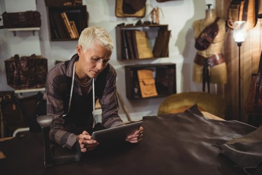 Craftswoman using digital tablet