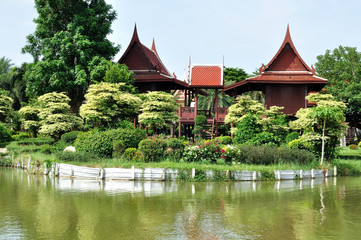 Thai Classic house next to lake in public garden.