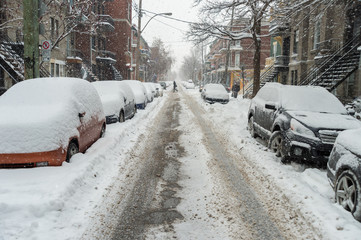 Fototapeta premium Cars covered in snow during snowstorm in Montreal, December 2016