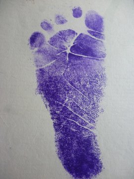 stamp foot on the babys birth certificate
