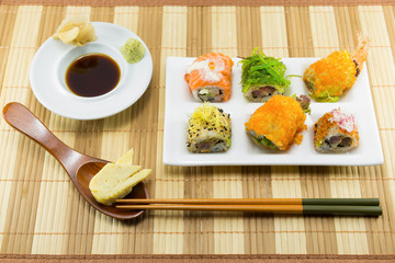 Sushi Set and sushi rolls served on wood table...