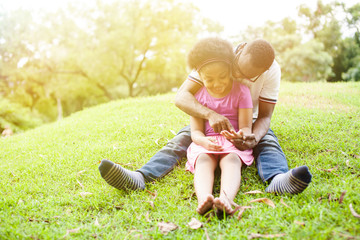 African American family playing together in the outdoor park