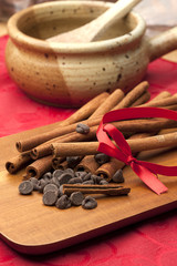 Close up of cinnamon sticks and chocolate chips.