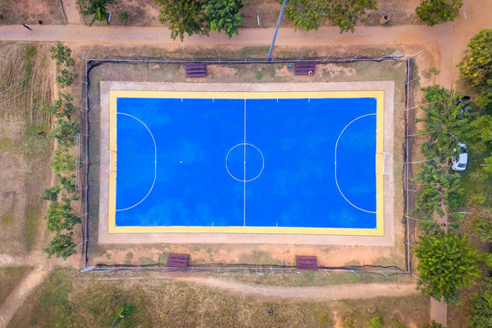 Top view aerial photo from flying drone over football field