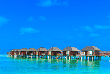  beach with water bungalows Maldives