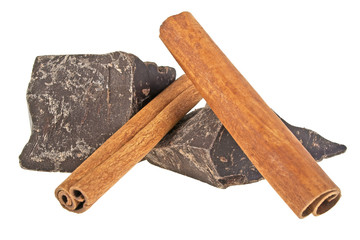 Chocolate bars and cinnamon sticks isolated on white background