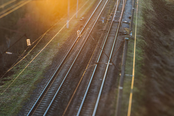 Naklejka na ściany i meble Railway in sunset, selective focus 