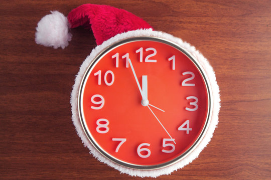 clock with christmas santa hat