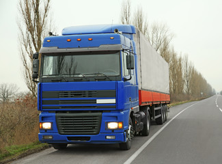 Fototapeta na wymiar Truck on road. Delivery and shipping concept.