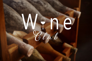 Text WINE CLUB on background. Shelving with different wine bottles in cellar