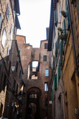 narrow street and old houses in Siena