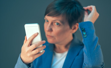 Business woman taking selfie portrait with mobile phone
