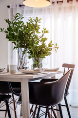 closed up nice dining chair with wooden table and dish sets inte