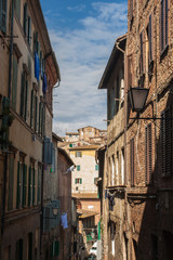 narrow street and old houses in Siena