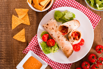 Tortilla wraps with chicken and vegetable. 