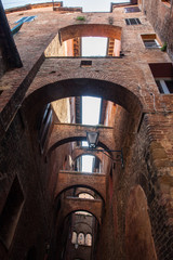 narrow street and old houses in Siena