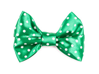 green bow with white polka dots isolated
