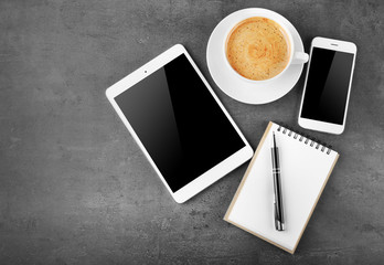 Top view of office desk with coffee and accessories