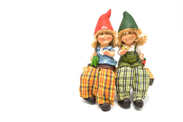 Two little vintage boy and girl resin doll on white background