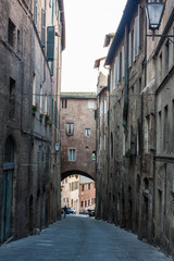 narrow street and old houses in Siena