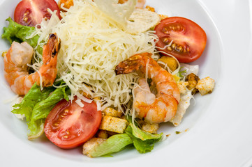 salad of fried shrimp, cherry tomatoes, croutons, cheese and fre