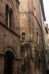 narrow street and old houses in Siena