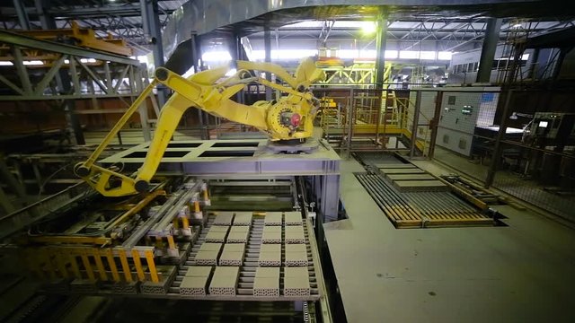 Automated machine. Industrial equipment working at a factory. HD.