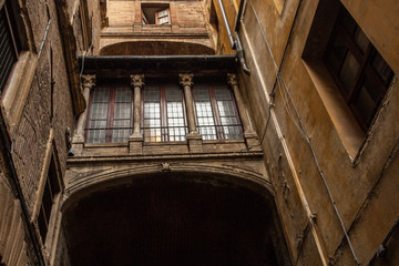 narrow street and old houses in Siena
